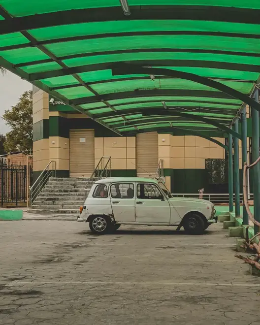 Car shade canopy over vehicles in a Kenyan parking lot