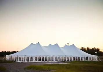 White event tent set up for an outdoor party